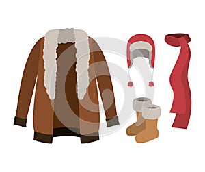 Winter clothes with fur coat and scarf and wool cap and boots over white background