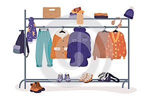 Winter clothes on racks. Fashion warm apparel on hanger. Wardrobe storage. Clothing assortment rail. Secondhand casual