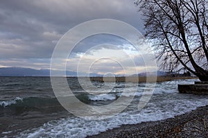 Winter cloudy landscape on the shore of Ohrid Lake. Northern Macedonia.