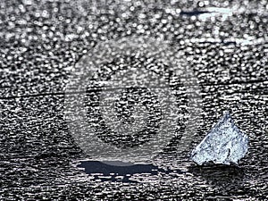 Winter coastal under icy cover. Icy andscape with broken pieces of blue ice.