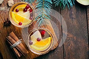 Winter Cocktail, Christmas Sangria with Apple Slices, Orange, Cranberry and Spices, Refreshing Drink