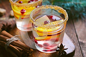 Winter Cocktail, Christmas Sangria with Apple Slices, Orange, Cranberry and Spices, Refreshing Drink