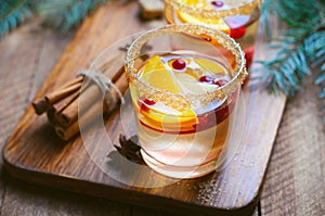 Winter Cocktail, Christmas Sangria with Apple Slices, Orange, Cranberry and Spices, Refreshing Drink