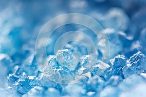 Winter cold background, blue crystals. Macro photo