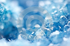 Winter cold background, blue crystals. Macro photo