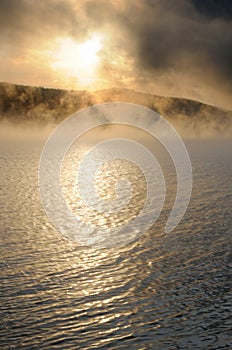 Winter cold foggy dawn on the Yenisei river