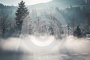 rural stunning winter landscape, picturesque morning foggy view, beautiful sunrise in mountains, Carpathians, Huzul village Krasni