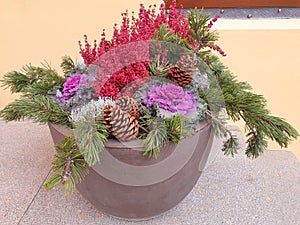 A winter composition of pink brassica and erica flowers.