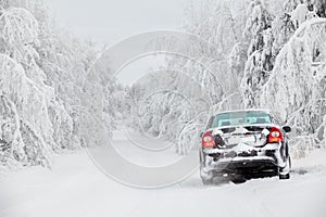 Winter country road with car on roadside