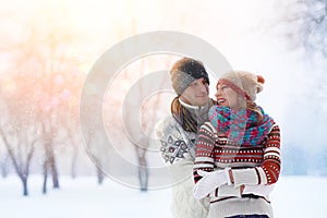 Winter couple. Happy Couple Having Fun Outdoors. Snow. Winter Vacation. Outdoor .