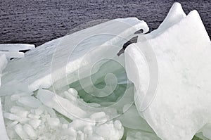 Winter day at the Dnieper river with piles of broken ice