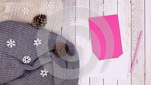 Winter decoration with paper for text and blinking lights on sweater. Stop motion