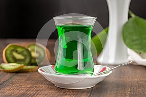 Winter drink kiwi oralet or oralette in a thin-waisted glass tea glass