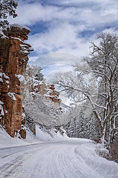 Winter drive after freshly fallen snow, with snow covered road