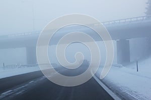 Winter driving in freezing fog on a country road