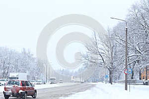 Winter Driving in Snow. Aerial winter view. Beautiful winter covered snow town in cold snowy day. Street.