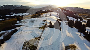 Winter drone photo of the Allgaeu Alps with the Gruenten in the backlight of the sun