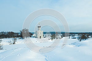 Winter drone shot of Church of the Intercession on the Nerl in Bogolubovo