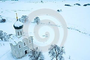 Winter drone view of Church of the Intercession on the Nerl in Bogolubovo