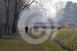 Winter is ending and people walk in nature