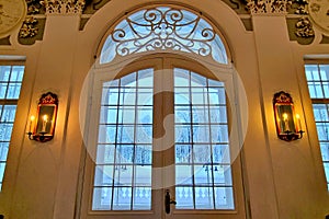 Winter evening landscape behind glazed door