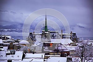 Winter evening in Lausanne.Skyline of Lausanne, Switzerland as seen from the Cathedral hill at sunset zoomed-in on the tower of St