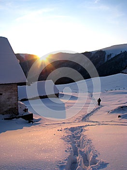 Winter evening in the mountainous village. photo