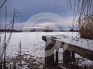 Winter evening by the pond