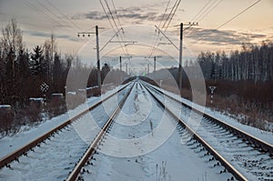 Winter evening in snowy fields of Russian province