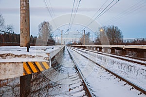 Winter evening in snowy fields of Russian province