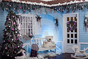 Winter exterior of a country house with Christmas decorations in