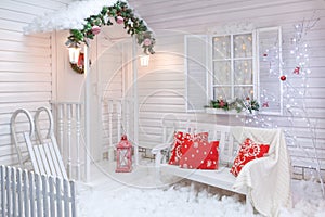 Winter exterior of a country house with Christmas decorations.