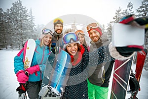 winter, extreme sport and people concept - Group of smiling friends making selfie