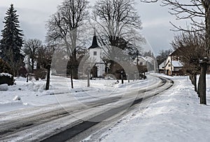 A winter fairytale in a small village with a white church