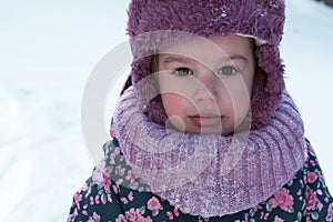 Winter, family, childhood concepts - close-up portrait authentic little preschool minor 3-4 years girl in pink hat look