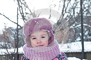 Winter, family, childhood concepts - close-up portrait authentic little preschool minor 3-4 years girl in pink hat look