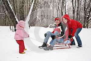 Winter family on sled