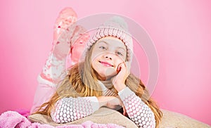 Winter fashion accessory. Kid girl knitted hat and scarf. Winter accessory concept. Girl long hair dream pink background