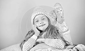 Winter fashion accessory. Kid girl knitted hat and scarf. Winter accessory concept. Girl long hair dream pink background