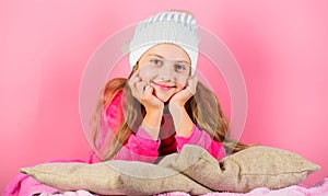 Winter fashion accessory. Kid girl knitted hat. Winter accessory concept. Girl long hair dream pink background. Kid