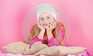 Winter fashion accessory. Kid girl knitted hat. Winter accessory concept. Girl long hair dream pink background. Kid