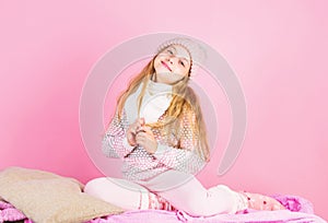 Winter fashion accessory. Winter accessory concept. Girl long hair dreamy mood pink background. Kid smiling wear knitted