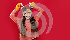 winter fashion for winking teen girl. teen girl fashion model in winter earflap hat. teen girl