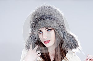 Winter fashion woman in a fur hat.