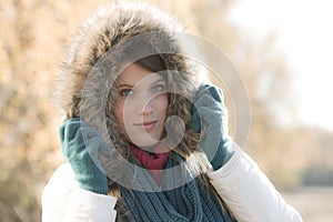 Winter fashion - woman with fur hood outdoors