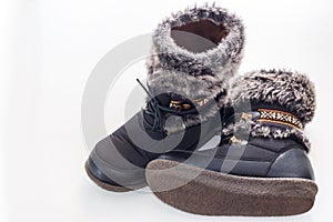 Winter female boot with fur isolated over white