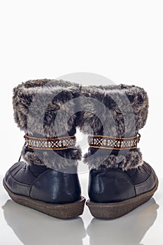Winter female boot with fur isolated over white