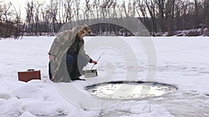 Winter fishing in the hole.