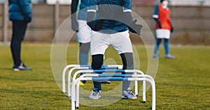 Winter Football Soccer Training Session with Hurdles. Athlete Player Practice Hurdles