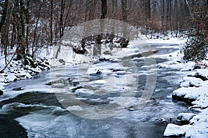 Winter forest, frozen river, winter landscape, ice on the water